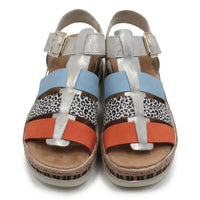 Colorful sandals with patterned straps on a white background