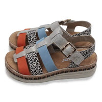 Colorful sandals with patterned straps on a white background