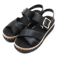 Black sandals with a cork sole on a white background