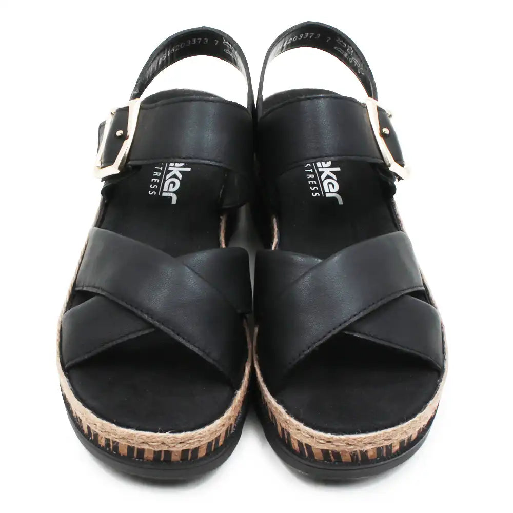 Pair of black sandals with cork sole on a white background