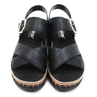 Pair of black sandals with cork sole on a white background