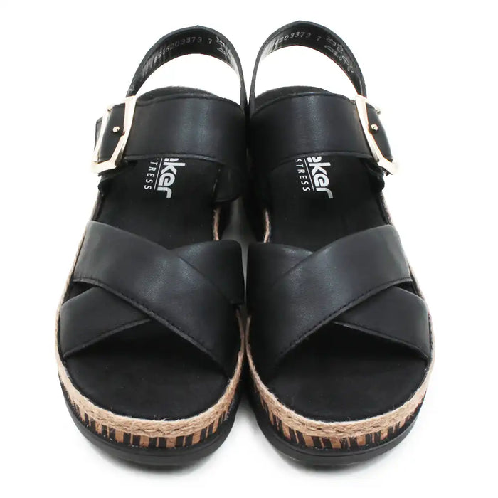 Pair of black sandals with cork sole on a white background
