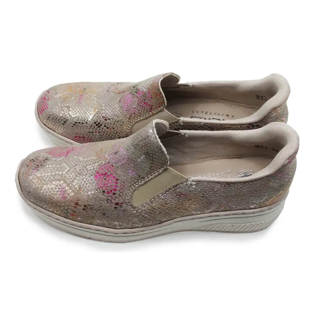 Pair of glittery shoes with floral patterns on a white background
