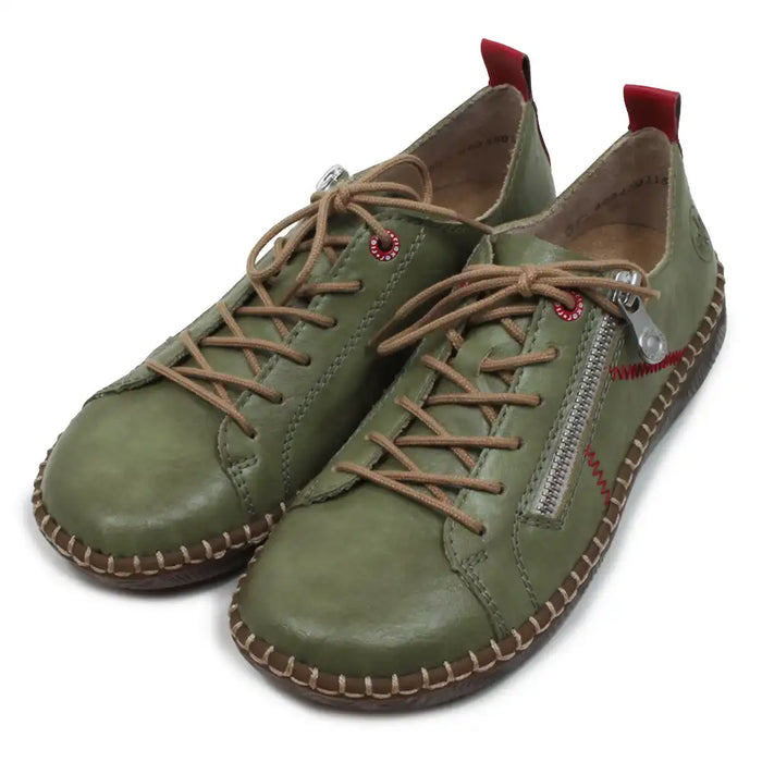 Pair of green leather shoes with brown laces on a white background