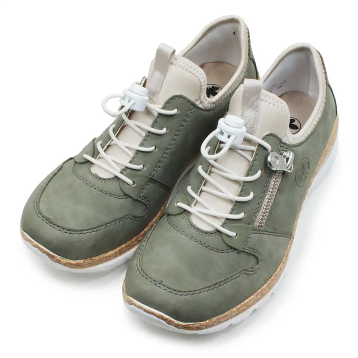 Green trainers with white elastic fastening.
