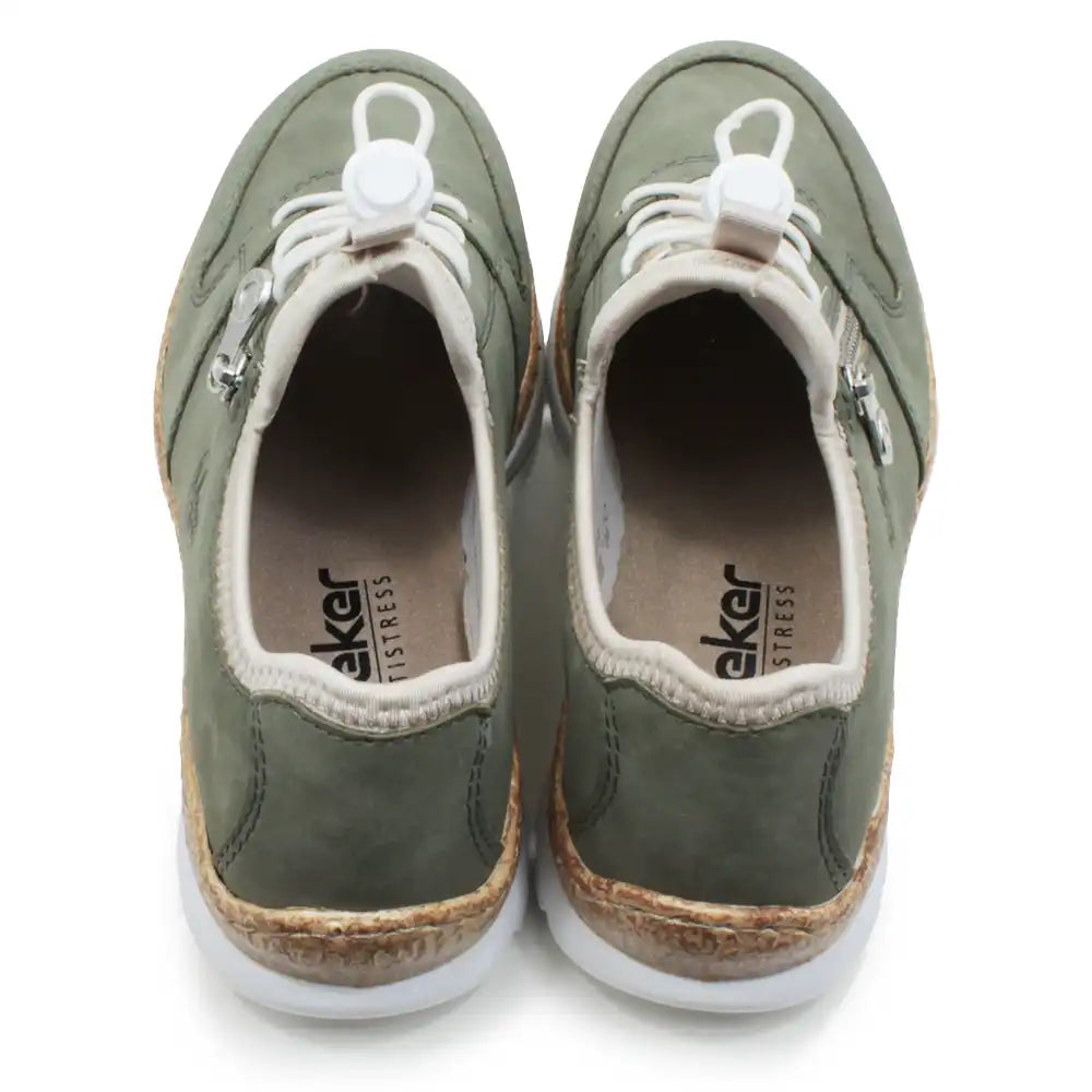 Pair of green sneakers with white laces on a white background
