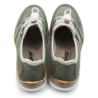 Pair of green sneakers with white laces on a white background