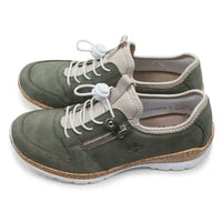 Pair of green casual shoes with white laces on a white background