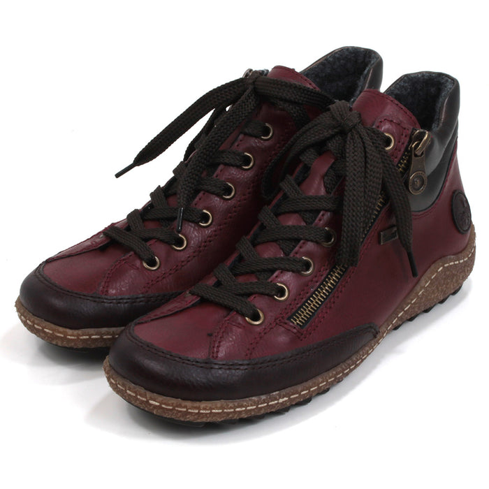 A pair of dark red Rieker high-top ankle boots with burgundy accents, featuring a lace-up closure and a side zip.