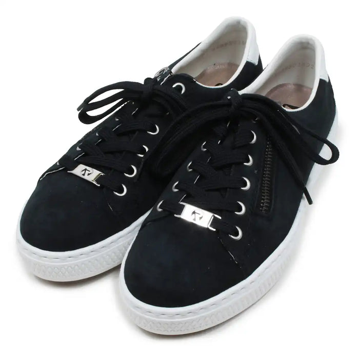 Navy sneakers with white soles on a white background