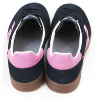 Navy blue trainers with pink R on the sides and white and pink around the ankle cuffs. Tan rubber soles. Rieker branding on the tongues. Back view.