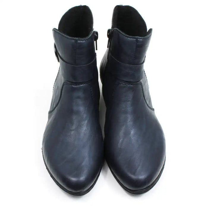 Rieker navy blue ankle boots with almond shaped toes. Strap detail around lower ankle. Zip fastening on the inside of the botts. Mid heel. Front view.