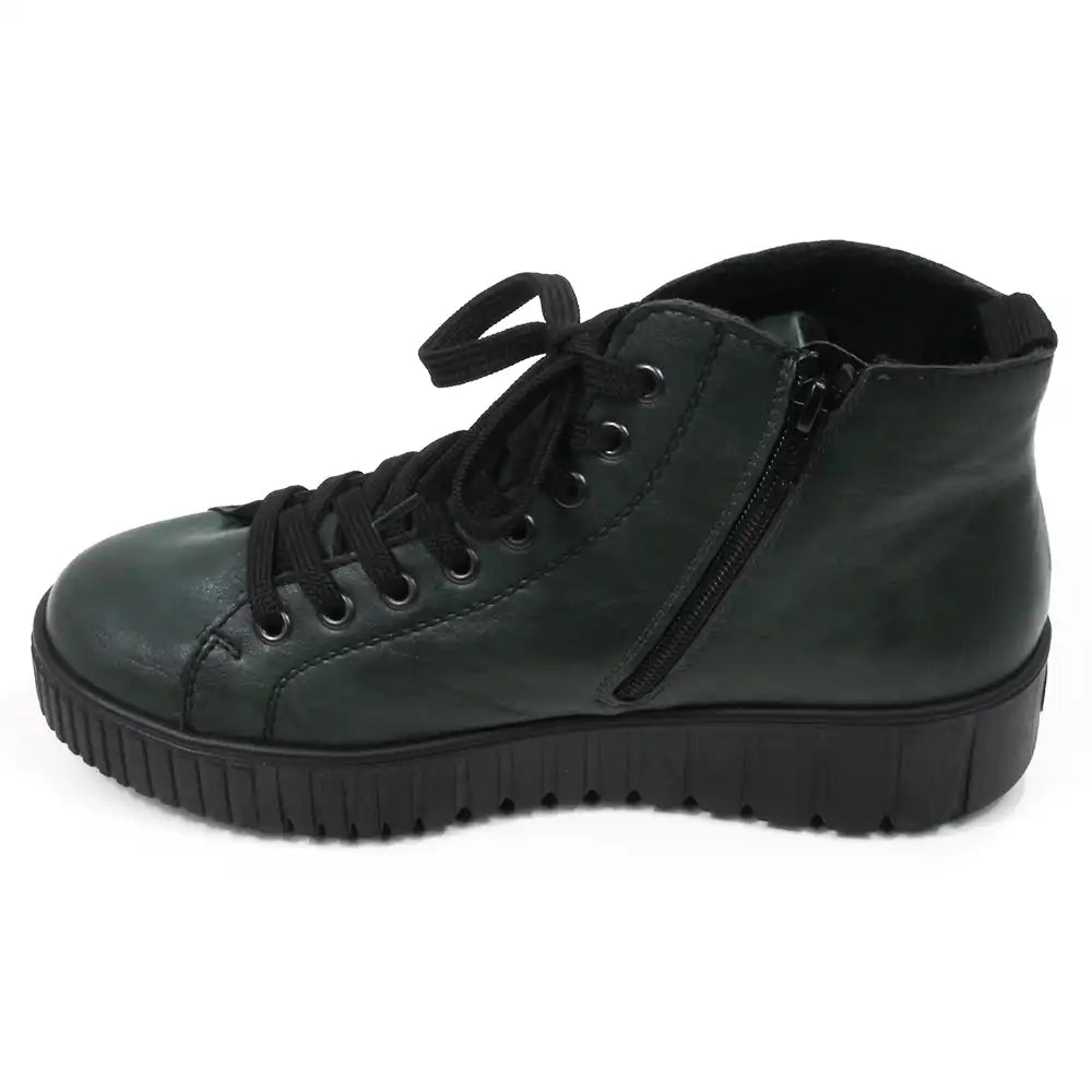 Green ankle boot with black laces on a white background. View showing zip.