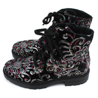 Black sequined combat style boots.