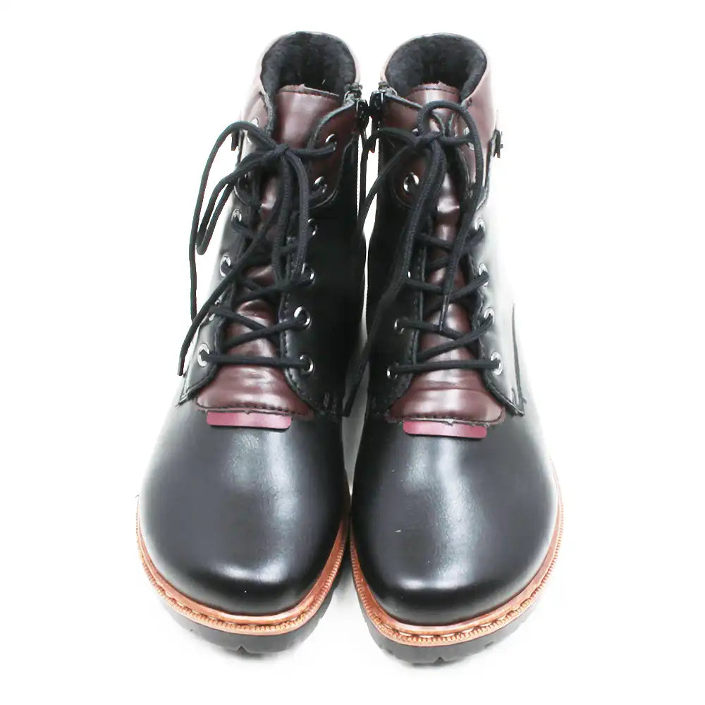 A pair of lace-up ankle boots with black leather uppers, dark brown leather panels at the collar and toe, black laces, and a light brown sole, shown against a plain white background.
