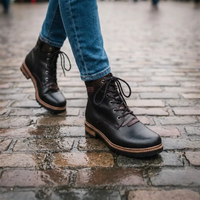 Rieker boots being worn on a wet historic paving.