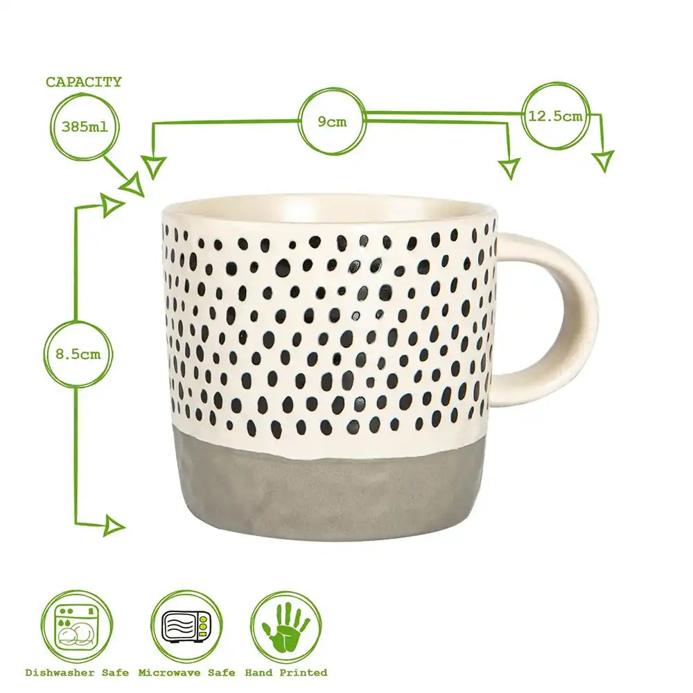 Ceramic mug with black dot pattern and measurements on a white background