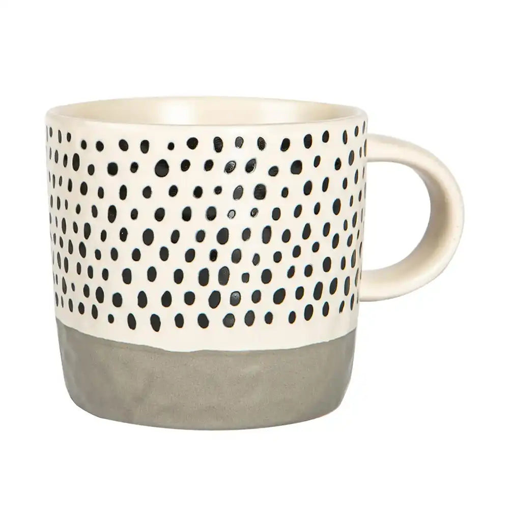 Mug with black dot pattern and gray base on a white background