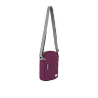 Purple crossbody bag with a gray strap on a white background