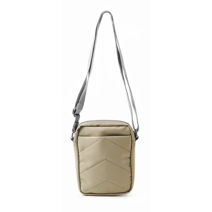 Beige crossbody bag with a chevron pattern on a white background