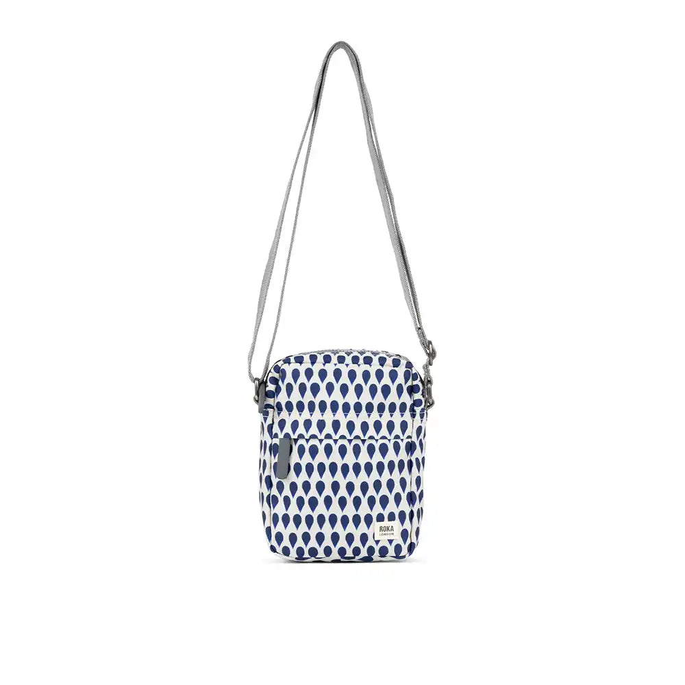 Small crossbody bag with blue and white pattern on a white background