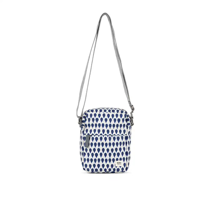 Small crossbody bag with blue and white pattern on a white background