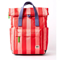 Front of pale pink and red stripey backpack with purple handle and lime green zip toggles. 