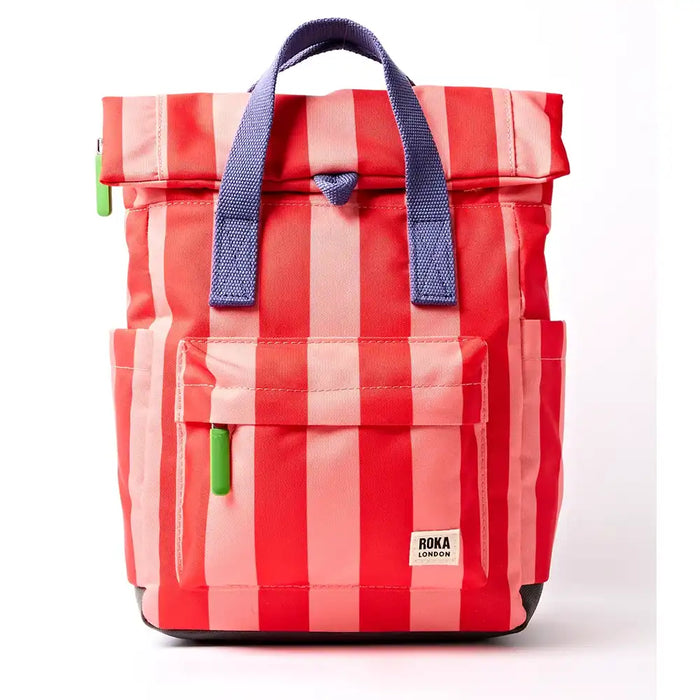 Front of pale pink and red stripey backpack with purple handle and lime green zip toggles. 
