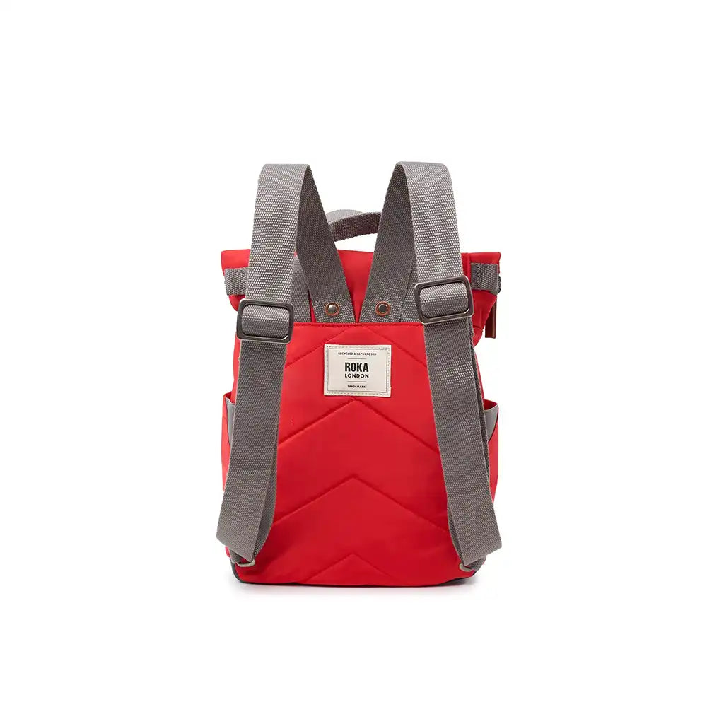 Red backpack with gray straps on a white background