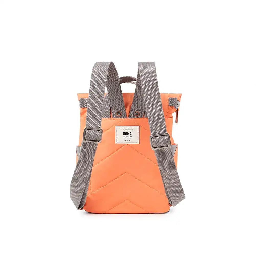 Orange backpack with gray straps on a white background