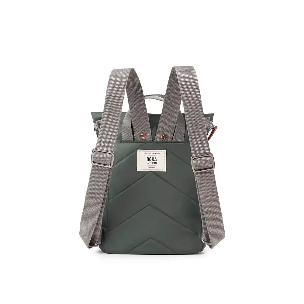 Green backpack with gray straps on a white background