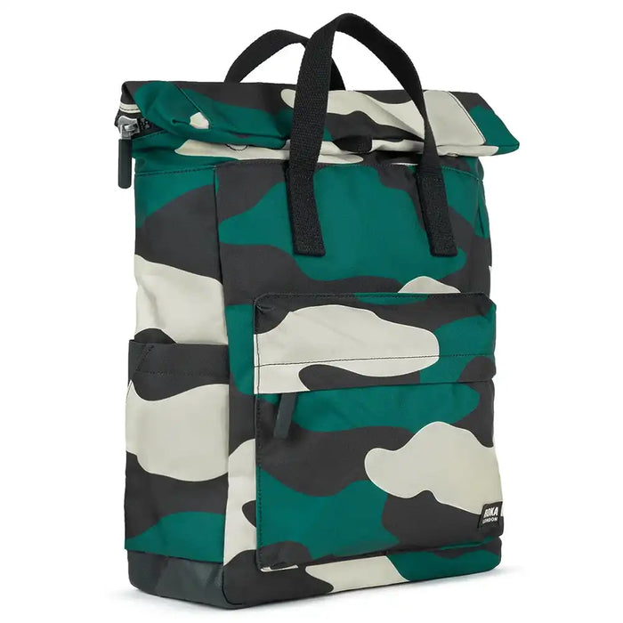 Roka camouflage backpack with black canvas straps and handles. Foldover zipped top opening. External zipped pocket. Open pockets on each side.