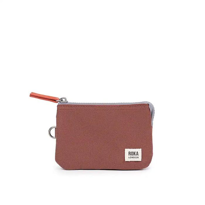 Brown pouch with a visible brand label on a white background