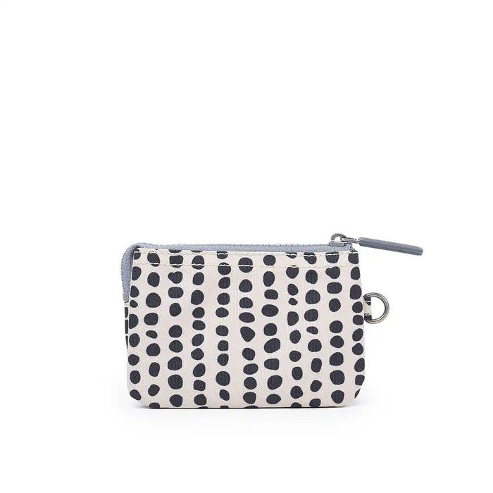 Small pouch with black dot pattern on a white background