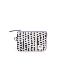 Small pouch with black dot pattern on a white background