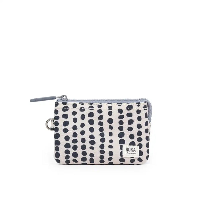 Small pouch with black dot pattern on a white background