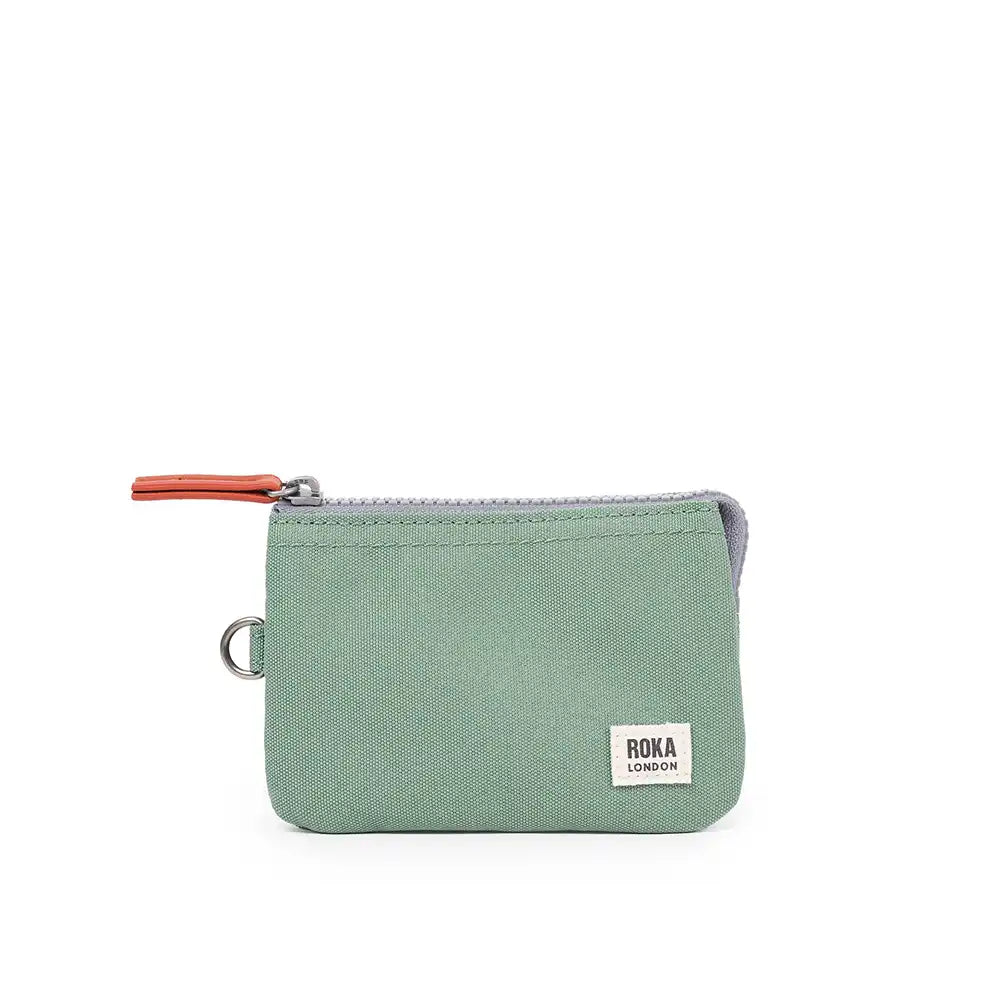 Green zippered pouch with 'ROKA London' label on a white background