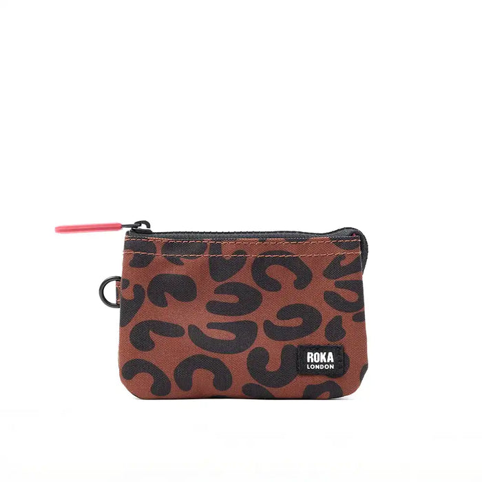 Small pouch with black wavy pattern and Roka London branding on a white background