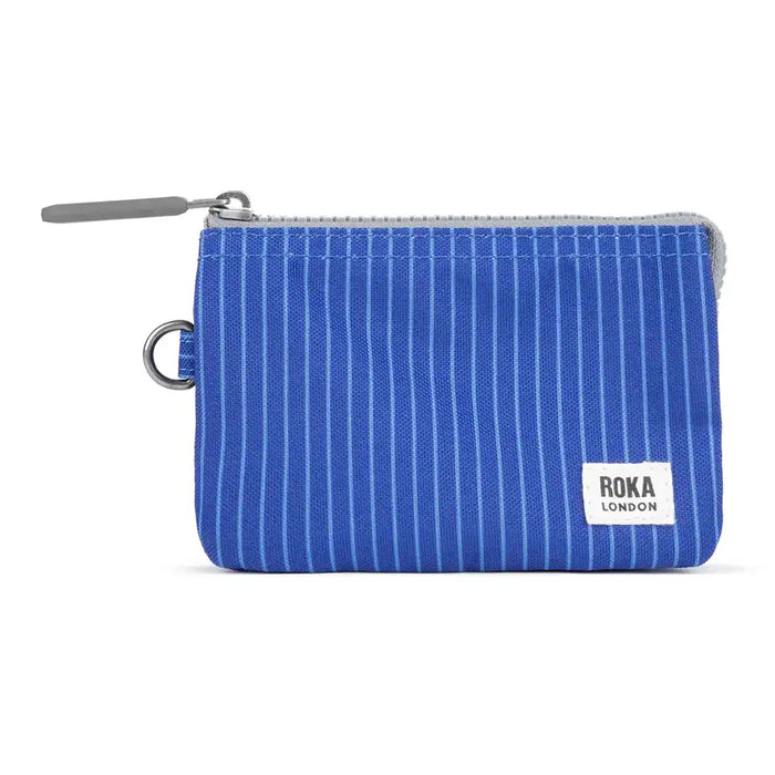 Blue striped pouch with Roka London logo on a white background