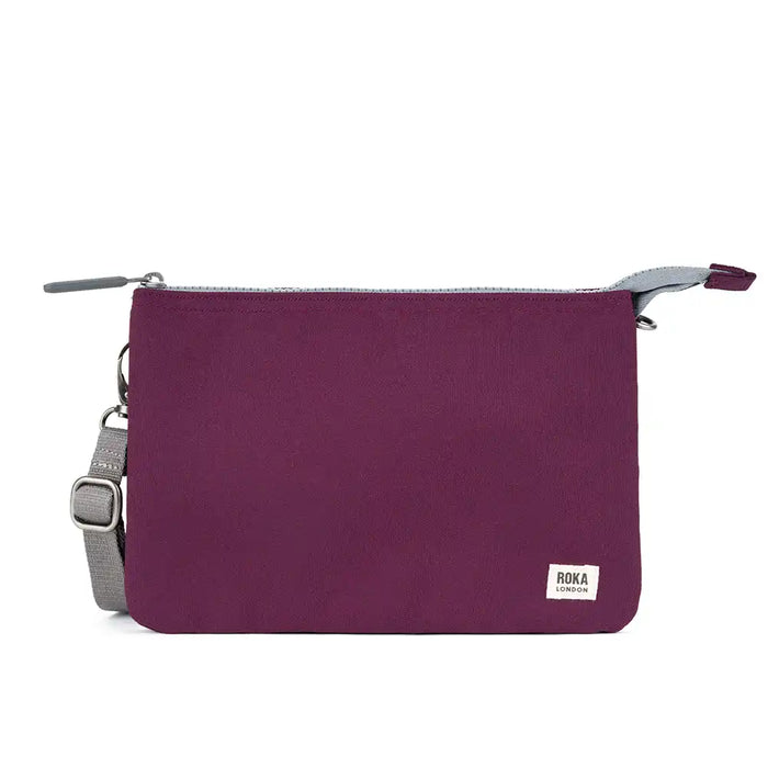 Purple bag with a gray strap on a white background