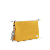 Yellow pouch with a strap on a white background