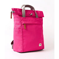 Side of a fuchsia coloured backpack with grey straps.
