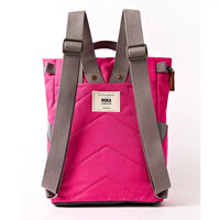 Back of a fuchsia coloured backpack with grey straps.