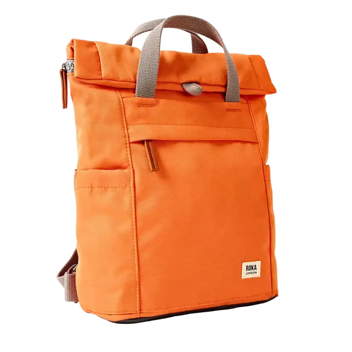 Side view of an Orange backpack with grey straps on a white background