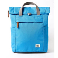 Front of blue backpack with grey straps.