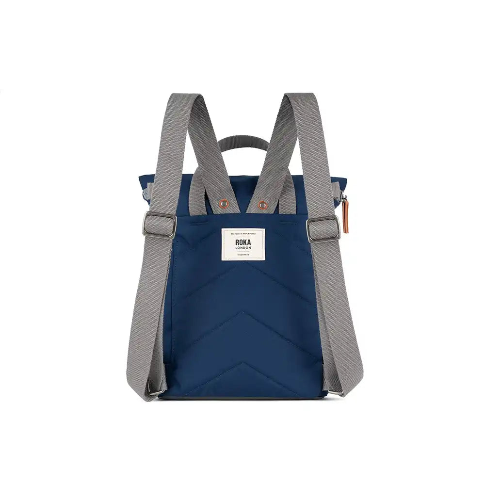 Blue backpack with gray straps on a white background