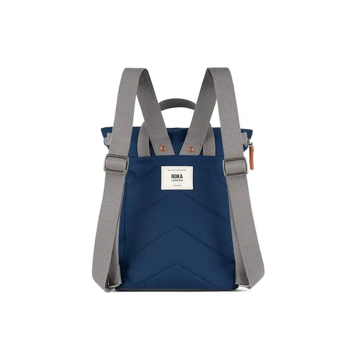 Blue backpack with gray straps on a white background