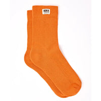 Crew style sock with 'Roka London' badge on the cuff. In a orange colour.