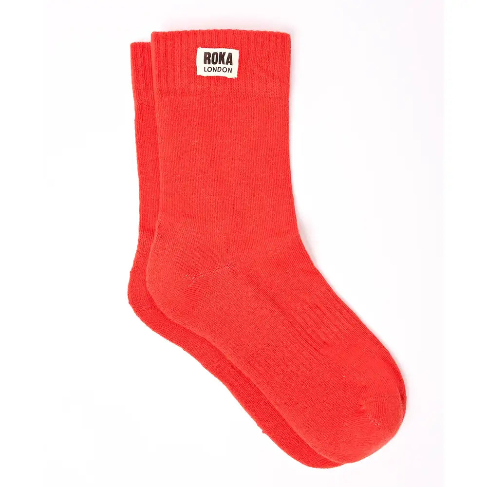 Crew style sock with 'Roka London' badge on the cuff. In a red colour.