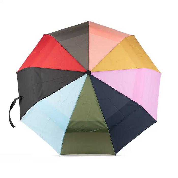 Multicolored umbrella with red, black, pink, yellow, blue, green, and purple sections on a white background.